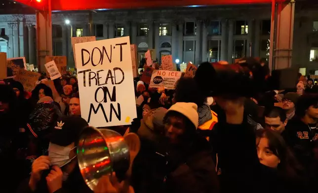 People participate in a protest and noise demonstration calling for an end to federal immigration enforcement operations in the city, Friday, Jan. 9, 2026, in Minneapolis. (AP Photo/Jen Golbeck)