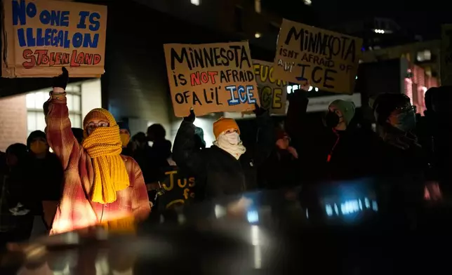 People participate in a protest and noise demonstration calling for an end to federal immigration enforcement operations in the city, Friday, Jan. 9, 2026, in Minneapolis. (AP Photo/John Locher)