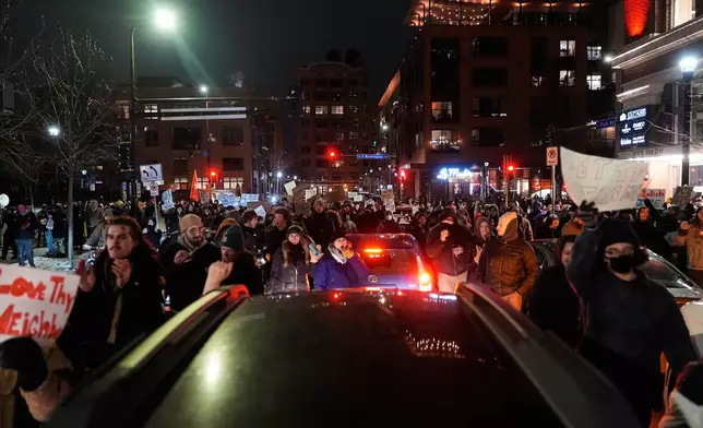People participate in a protest and noise demonstration calling for an end to federal immigration enforcement operations in the city, Friday, Jan. 9, 2026, in Minneapolis. (AP Photo/Jen Golbeck)