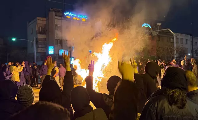 Iranians attend an anti-government protest in Tehran, Iran, Friday, Jan. 9, 2026. (AP Photo)