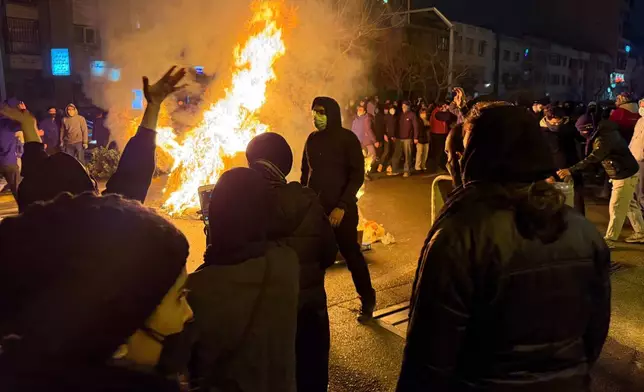 In this photo obtained by The Associated Press, Iranians attend an anti-government protest in Tehran, Iran, Friday, Jan. 9, 2026. (UGC via AP)