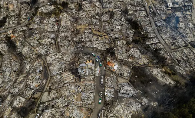 Areas lie burned by wildfires near Lirquen, Chile, Sunday, Jan. 18, 2026. (AP Photo/Javier Torres)