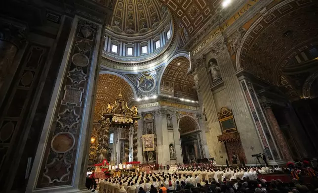 Pope Leo XIV celebrates Mass on New Year's Day, in St. Peter's Basilica at the Vatican, Thursday, Jan. 1, 2026. (AP Photo/Alessandra Tarantino)