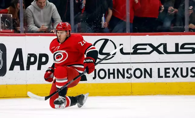 Carolina Hurricanes' Logan Stankoven (22) celebrates his goal against the Seattle Kraken during the first period of an NHL hockey game in Raleigh, N.C., Saturday, Jan. 10, 2026. (AP Photo/Karl DeBlaker)
