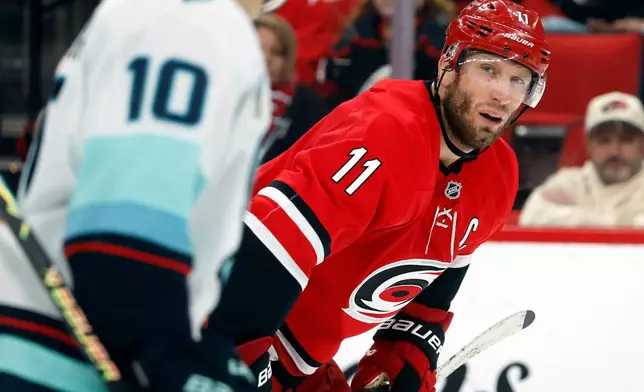 Carolina Hurricanes' Jordan Staal (11) readies for a face-off against the Seattle Kraken during the second period of an NHL hockey game in Raleigh, N.C., Saturday, Jan. 10, 2026. (AP Photo/Karl DeBlaker)