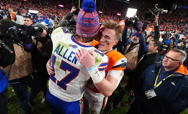 Buffalo Bills quarterback Josh Allen (17) greets Denver Broncos quarterback Bo Nix (10) after an NFL divisional round playoff football game, Saturday, Jan. 17, 2026, in Denver. (AP Photo/Jack Dempsey)