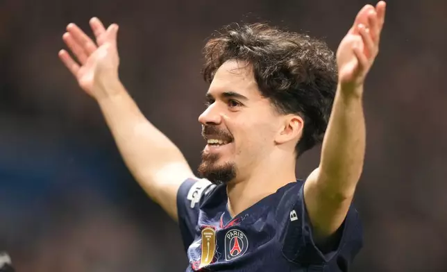 PSG's Vitinha celebrates after scoring his side's opening goal during a Champions League opening phase soccer match between Paris Saint-Germain and Newcastle in Wednesday, Jan. 28, 2026. (AP Photo/Michel Euler)