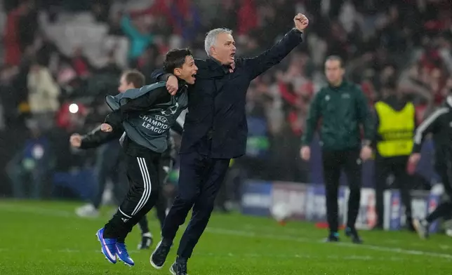 Benfica's head coach Jose Mourinho celebrates at the end of a Champions League opening phase soccer match between Benfica and Real Madrid, in Lisbon, Wednesday, Jan. 28, 2026. (AP Photo/Armando Franca)