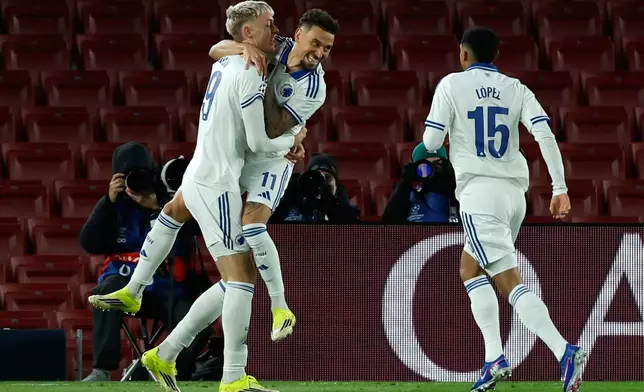 Copenhagen's Vicktor Dabason celebrates with Jordan Larsson the opening goal during the Champions League opening phase soccer match between Barcelona and Copenhagen in Barcelona, Spain, on Wednesday, Jan. 28, 2026. (AP Photo/Joan Monfort)