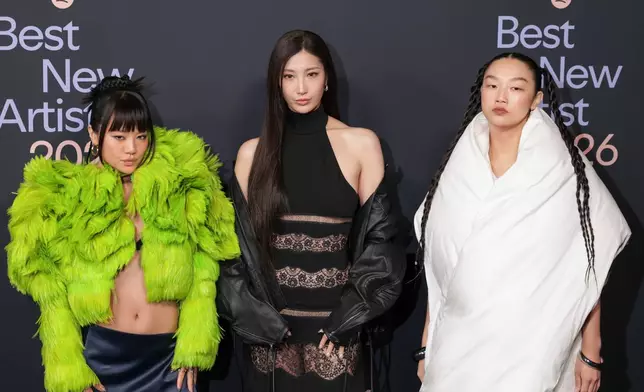 From left, Rei Ami, EJAE, and Audrey Nuna of HUNTR/X arrive at the Spotify Best New Artist Party on Thursday, Jan. 29, 2026, in Los Angeles. (Photo by Andrew Park/Invision/AP)
