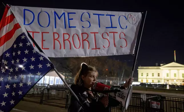Heather Griffis joins others to protest U.S. Immigration and Customs Enforcement, near the White House, following the fatal shooting of a woman by an Immigration and Customs Enforcement officer in Minneapolis, Thursday, Jan. 8, 2026, in Washington. (AP Photo/Rod Lamkey, Jr.)