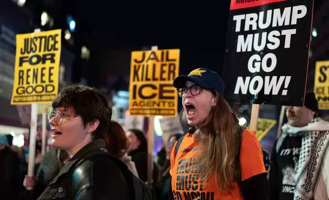 Demonstrators rally before marching to the White House in Washington, Thursday, Jan. 8, 2026, as they protest against the Immigration and Customs Enforcement (ICE) agent who fatally shot Renee Nicole Good in Minneapolis. (AP Photo/Jose Luis Magana)