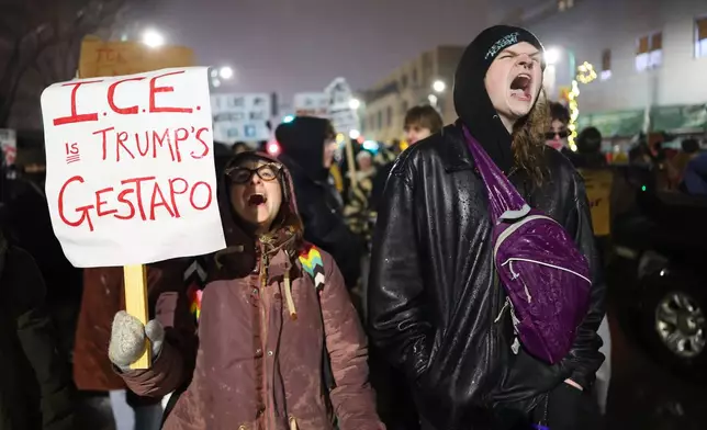 Protesters gather during a rally for Renee Good, Thursday, Jan. 8, 2026, in Minneapolis, after she was fatally shot by an ICE officer the day before. (AP Photo/Adam Bettcher)