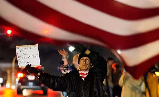 John Brown protests during a rally for Renee Good, who was fatally shot by an ICE officer in Minneapolis the day before, Thursday, Jan. 8, 2026, in Kansas City, Mo. (AP Photo/Charlie Riedel)
