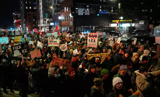 EDS NOTE: OBSCENITY - People participate in a protest and noise demonstration calling for an end to federal immigration enforcement operations in the city, Friday, Jan. 9, 2026, in Minneapolis. (AP Photo/John Locher)
