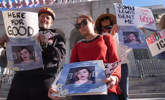 Demonstrators gather in remembrance for Renee Good, a Minneapolis woman who was shot and killed by an Immigration and Customs Enforcement officer in Minnesota, Thursday, Jan. 8, 2026, in Los Angeles. (AP Photo/Damian Dovarganes)