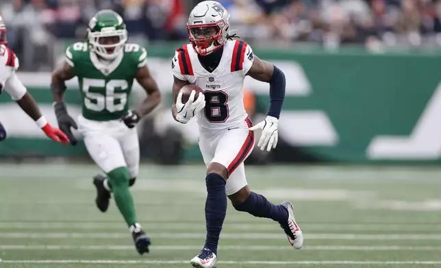 New England Patriots wide receiver Stefon Diggs (8) runs against the New York Jets during the first half of an NFL football game, Sunday, Dec. 28, 2025, in East Rutherford, N.J. (AP Photo/Adam Hunger)