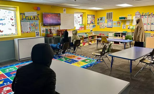 Children watch television at ABC Learning Center in Minneapolis, Minn., on Wednesday, Dec. 31, 2025. (AP Photo/Mark Vancleave)