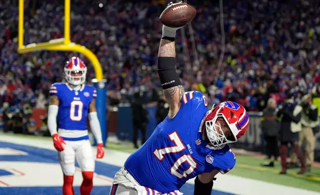 Buffalo Bills offensive tackle Alec Anderson (70) spikes the ball after running back Ty Johnson scored a touchdown against the New York Jets in the first half of an NFL football game Sunday, Jan. 4, 2026, in Orchard Park, N.Y. (AP Photo/Seth Wenig)