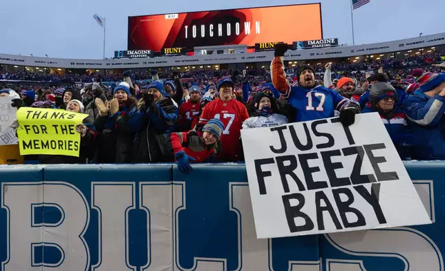Fans celebrate after the Buffalo Bills scored a touchdown during the first half of an NFL football game against the New York Jets, Sunday, Jan. 4, 2026, in Orchard Park, N.Y. (AP Photo/Carolyn Kaster)