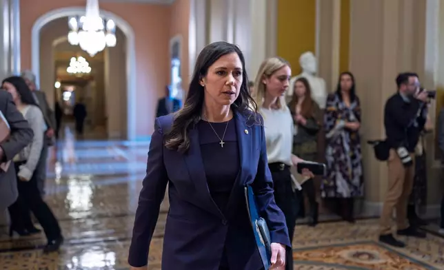 Sen. Katie Britt, R-Ala., who chairs the Department of Homeland Security Appropriations Subcommittee, walks to the chamber following a closed-door meeting with fellow Republicans on spending legislation, at the Capitol in Washington, Wednesday, Jan. 28, 2026. (AP Photo/J. Scott Applewhite)