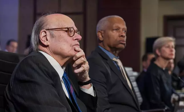As House Democrats convene for an unofficial hearing on the 5th anniversary of the Jan. 6, 2021, riot by supporters of President Donald Trump, Rep. Steve Cohen, D-Tenn., left, and Rep. Hank Johnson, D-Ga., watch a video showing the storming of Capitol and the violent attack on Capitol Police officers, at the Capitol in Washington, Tuesday, Jan. 6, 2026. (AP Photo/J. Scott Applewhite)