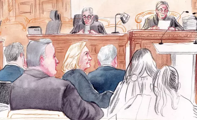 In this courtroom sketch, French far-right leader Marine Le Pen, center left, appears in court with other members of the far-right National Rally party, to appeal an embezzlement conviction that risks affecting her 2027 presidential ambitions Tuesday, Jan. 13, 1970 in Paris. (AP Photo/Valentin Pasquier)