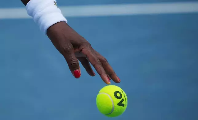 Venus Williams of the United States prepares to serve during a practice session ahead of the Australian Open tennis championship in Melbourne, Australia, Friday, Jan. 16, 2026. (AP Photo/Dita Alangkara)