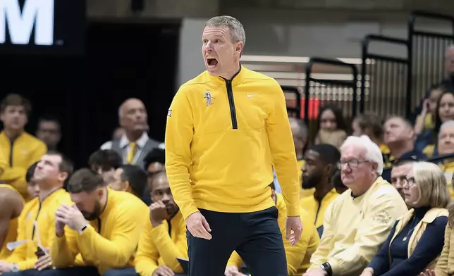 West Virginia coach Ross Hodge reacts during the first half of an NCAA college basketball game against Kansas Saturday, Jan. 10, 2026, in Morgantown, W.Va. (AP Photo/Kathleen Batten)
