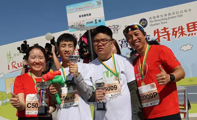 CARE@hkjc Volunteer Team members and runners receive the trophy for the Corporate Social Inclusion Tournament.