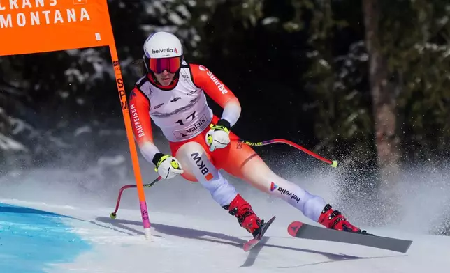 Switzerland's Malorie Blanc speeds down the course during an alpine ski, women's World Cup Super G, in Crans Montana, Switzerland, Saturday, Jan. 31, 2026. (AP Photo/Pier Marco Tacca)