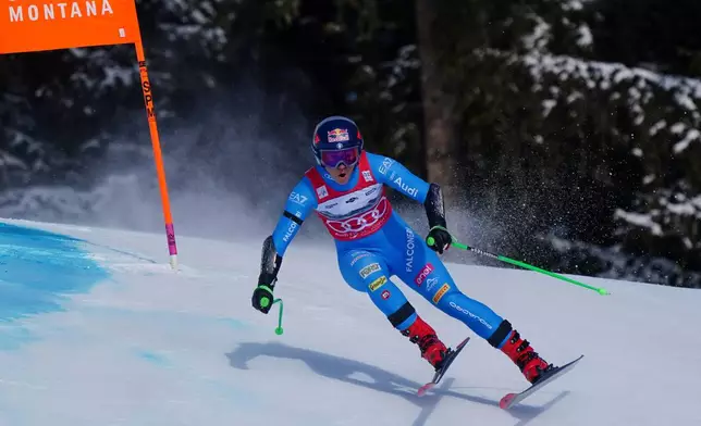 Italy's Sofia Goggia speeds down the course during an alpine ski, women's World Cup Super G, in Crans Montana, Switzerland, Saturday, Jan. 31, 2026. (AP Photo/Pier Marco Tacca)