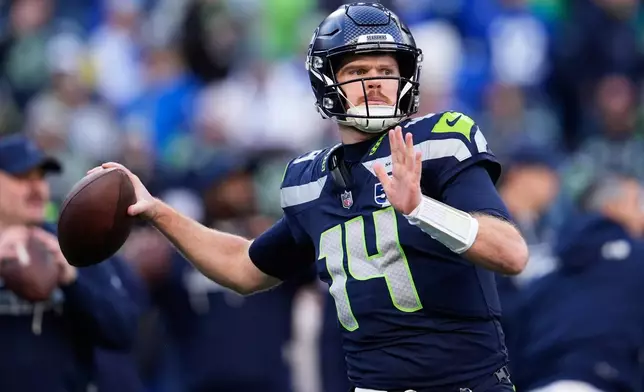 Seattle Seahawks quarterback Sam Darnold warms up before the NFC Championship NFL football game against the Los Angeles Rams, Sunday, Jan. 25, 2026, in Seattle. (AP Photo/Godofredo A. Vásquez)