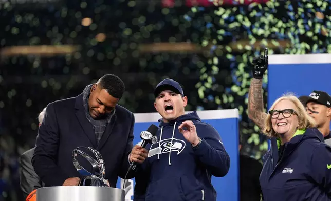 Michael Strahan left stands next to Seattle Seahawks head coach Mike Macdonald after a win over Los Angeles Rams in the NFC Championship NFL football game Sunday, Jan. 25, 2026, in Seattle. (AP Photo/Godofredo A. Vásquez)