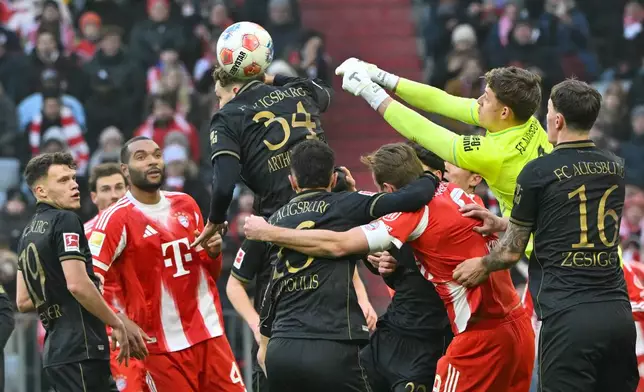Augsburg's goalkeeper Finn Dahmen in action during the German Bundesliga soccer match between Bayern Munich and FC Augsburg in Munich, Saturday, Jan. 24, 2026. (Peter Kneffel/dpa via AP)
