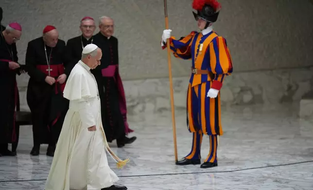 Pope Leo XIV arrives for his weekly general audience in the Paul VI Hall at the Vatican, Wednesday, Jan. 7, 2026. (AP Photo/Alessandra Tarantino)