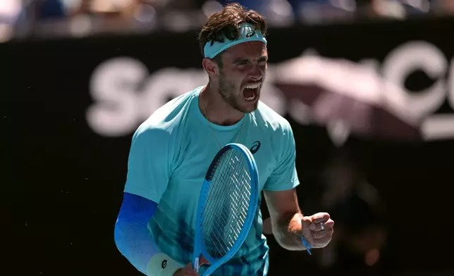 Lorenzo Musetti of Italy reacts as he plays against Taylor Fritz of the U.S. during their fourth round match at the Australian Open tennis championship in Melbourne, Australia, Monday, Jan. 26, 2026. (AP Photo/Asanka Brendon Ratnayake)