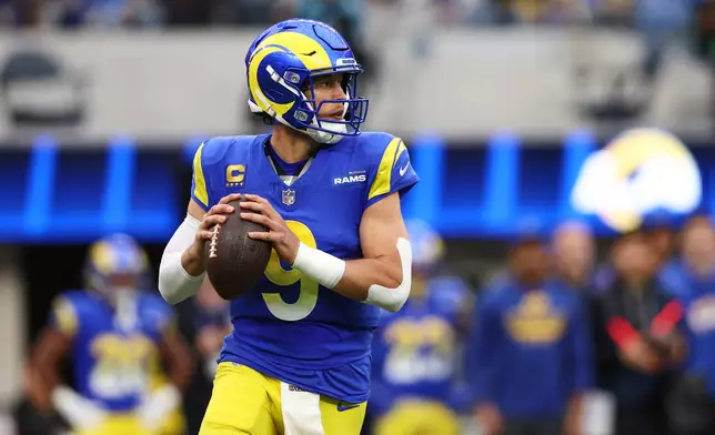 Los Angeles Rams quarterback Matthew Stafford (9) looks to pass during the first half of an NFL football game against the Arizona Cardinals, Sunday, Jan. 4, 2026, in Inglewood, Calif. (AP Photo/Jessie Alcheh)