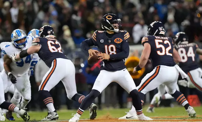 Chicago Bears quarterback Caleb Williams (18) throws a pass during the second half of an NFL football game against the Detroit Lions, Sunday, Jan. 4, 2026, in Chicago. (AP Photo/Nam Y. Huh)
