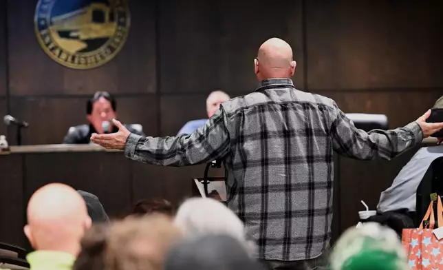 Mike Petak of Spring City gestures while speaking to East Vincent Township supervisors in opposition to a data center proposal at the former Pennhurst state hospital grounds, Dec. 17, 2025, in Spring City, Pa. (AP Photo/Marc Levy)