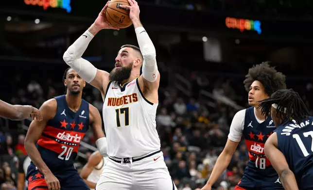 Denver Nuggets center Jonas Valanciunas (17) looks to shoot during the first half of an NBA basketball game against the Washington Wizards, Thursday, Jan. 22, 2026, in Washington. (AP Photo/John McDonnell)