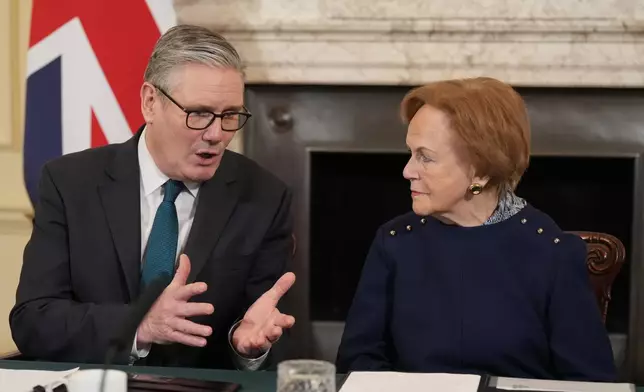 Britain's Prime Minister Keir Starmer sits with Mala Tribich, a survivor of the Holocaust as they address a cabinet meeting at Downing Street in London, Tuesday, Jan. 27, 2026. (AP Photo/Alastair Grant, Pool)