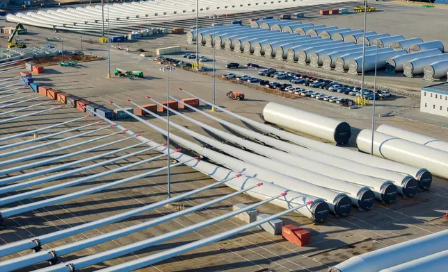 FILE - Wind turbine bases, generators and blades sit at The Portsmouth Marine terminal that is the staging area for Dominion Energy Virginia, which is developing Coastal Virginia Offshore Wind, Dec. 22, 2025, in Portsmouth, Va. (AP Photo/Steve Helber, File)