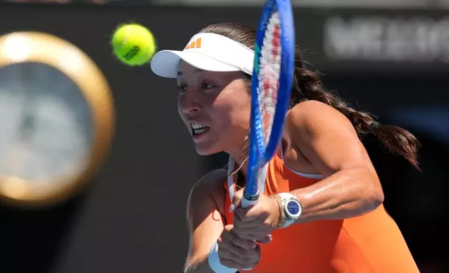 Jessica Pegula of the U.S. plays a backhand return to her compatriot Madison Keys during their fourth round match at the Australian Open tennis championship in Melbourne, Australia, Monday, Jan. 26, 2026. (AP Photo/Mark Baker)