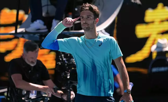 Lorenzo Musetti of Italy celebrates after defeating Taylor Fritz of the U.S. in their fourth round match at the Australian Open tennis championship in Melbourne, Australia, Monday, Jan. 26, 2026. (AP Photo/Asanka Brendon Ratnayake)