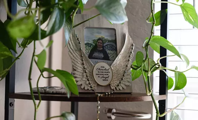 A framed photo of Robb Elementary teacher Irma Garcia is seen at the home of her sister, Velma Lisa Duran on Dec. 19, 2025, in San Antonio. (AP Photo/Kin Man Hui)