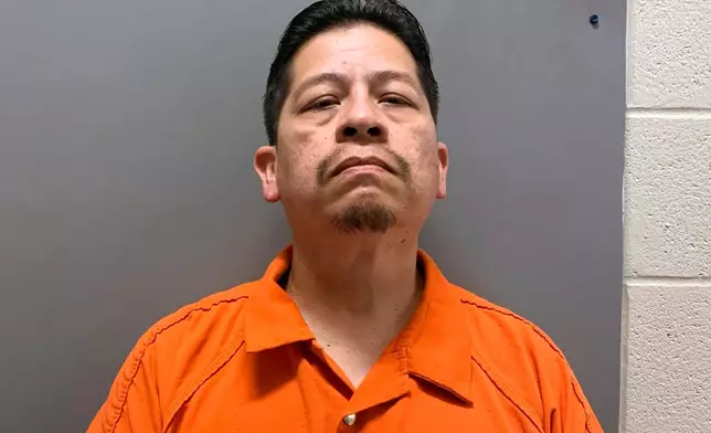 FILE - This booking image provided by the Uvalde County, Texas, Sheriff's Office shows Adrian Gonzales, a former police officer for schools in Uvalde, Texas. (Uvalde County Sheriff's Office via AP, File)