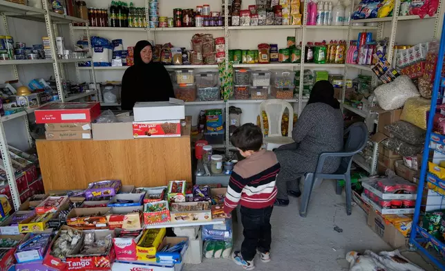 Maha al-Abbir, 47, a Syrian Shiite woman, works at her shop at the Imam Ali Housing Compound, where hundreds of mostly Lebanese and Syrian Shiite Muslims displaced from Syria reside, in Hermel, northeast Lebanon, Friday, Jan. 30, 2026. (AP Photo/Hussein Malla)