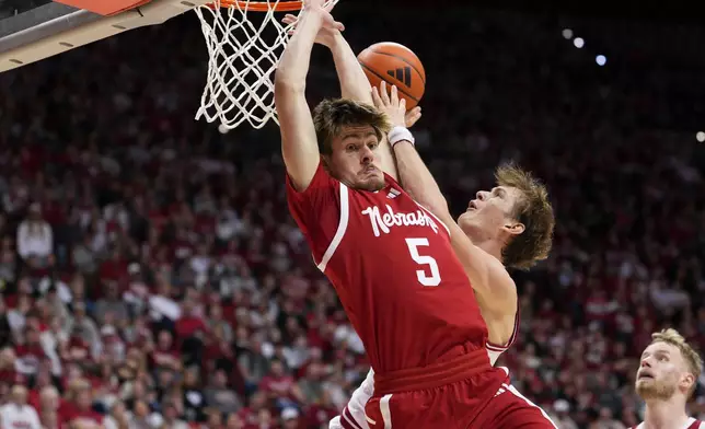 Indiana forward Reed Bailey, right behind, makes contact with Nebraska forward Braden Frager while shooting during the second half of an NCAA college basketball game in Bloomington, Ind., Saturday, Jan. 10, 2026. (AP Photo/AJ Mast)