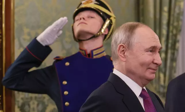 Russian President Vladimir Putin arrives for his meeting with Syrian interim President Ahmad al-Sharaa at the Grand Kremlin Palace in Moscow, on Wednesday, Jan. 28, 2026. (Maxim Shipenkov/Pool Photo via AP)